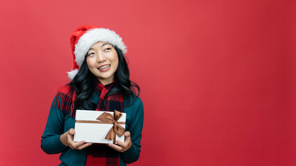 Woman holding gift box and rejoices. Happy birthday celebration, woman day, christmas.