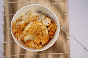 Asian food,  a bowl of rice with delicious meat crunchy and savory