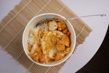 Asian food,  a bowl of rice with delicious meat crunchy and savory