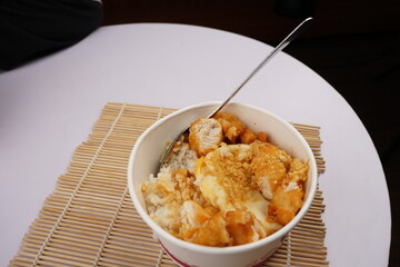 Asian food,  a bowl of rice with delicious meat crunchy and savory