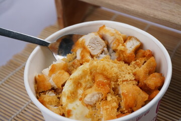 Asian food,  a bowl of rice with delicious meat crunchy and savory