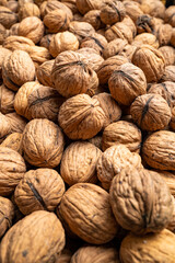 Walnuts, view of a large number of nuts, selective focus.