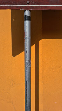 Metal Pole And Yellow Wall Texture Brazil