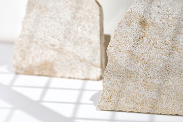 Background with Natural Stones for promotion on white background. Beauty product mockup. Scene, blank for show products. Showcase, display case, pedestals with window shadow.