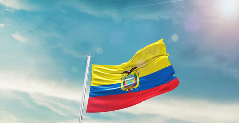 waving flag of Ecuador in blue sky. the symbol of the state on wavy cotton fabric.