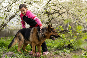 happy child girl with her dog
