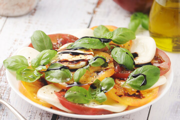 A plate with Italian salad caprese