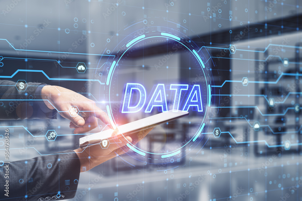 Poster close up of businessman hand pointing at tablet with glowing digital data hologram on blurry office 