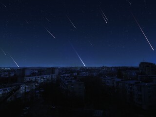 Meteor shower over the city. Meteor trails in the night sky with stars. Beautiful night landscape.
