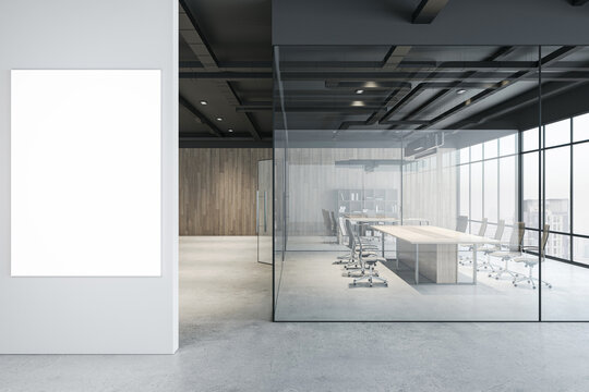 Front view on blank white poster on grey wall in modern interior office hall with conference room behind glass partitions, wooden walls background and city view from window. 3D rendering, mock up
