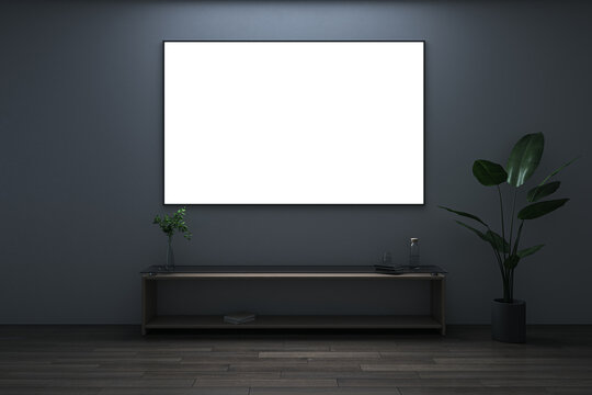 Front View On Bright Blank White Poster With Space For Your Logo Or Text On Black Wall Background In Total Dark Room With Green Plant On Wooden Floor. 3D Rendering, Mock Up