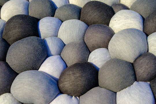 Different sizes, quantities of stuffed balls of fabric with sintepon. Soft decorative material.