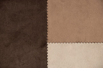 Three different brown fabrics, brown background, close up of velor fabric