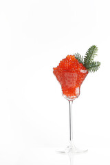 Caviar, a glass wine glass filled with red caviar. White background. Salmon caviar. Delicacies. Delicious food. Concept of delicious food. Space for text.