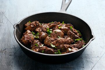 Fried chicken liver, poultry meat food with herbs
