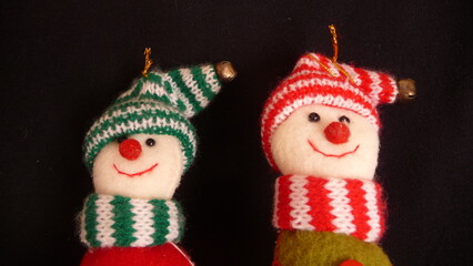 smiling christmas dolls. Green and red.
