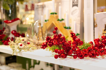 Fototapeta na wymiar Christmas decor with red berries. Selective focus