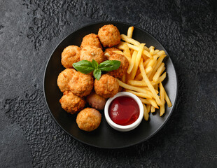 Mini Chicken kiev breast with french fries and ketchup