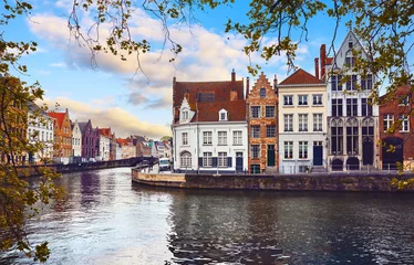 Photo sur Plexiglas Brugges Bruges Belgium. Old town with vintage houses at square glowing lantern and sunset sky. Picturesque landmark in Europe
