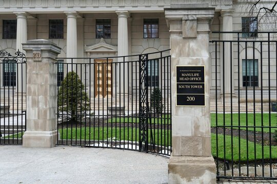 Toronto, Canada - December 2022:  Gate leading to the head office building of the Manulife Insurance Company.