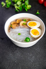 Pho Bo asian soup rice noodles funchose, egg, mushrooms meal food snack on the table copy space food background top view