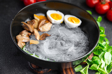 Pho Bo asian soup rice noodles funchose, egg, mushrooms meal food snack on the table copy space...
