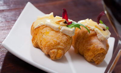 Mini croissant with Camembert, arugula and roasted pine nuts