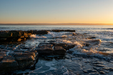 beautiful sunset over the rocky coast