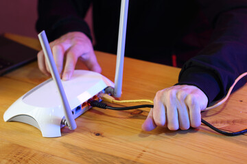 pulling out the internet cable from the router