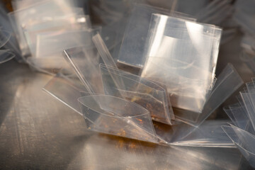 Gloved Worker Weighing & Packaging Cannabis Extract