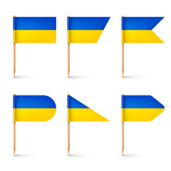 Realistic various Ukrainian toothpick flags. Souvenir from Ukraine. Wooden toothpicks with paper flag. Location mark, map pointer. Blank mockup for advertising and promotions. Vector illustration