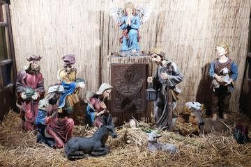 Christmas Manger scene with figurines newborn Jesus, Mary, Joseph