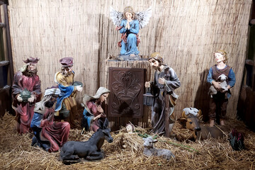 Christmas Manger scene with figurines newborn Jesus, Mary, Joseph
