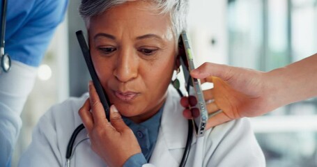 Busy, phone call and doctor with medical paperwork, health communication and help from nurse team at a hospital. Chaos, stress and healthcare consultant with anxiety from working medicine at a clinic - Powered by Adobe