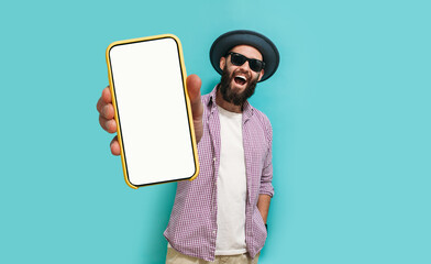 Young crazy bearded charismatic hipster showing big empty white smartphone screen for copy space...