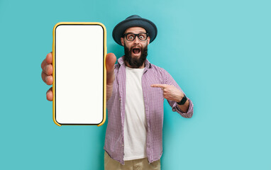 Young crazy bearded charismatic hipster showing big empty white smartphone screen for copy space...