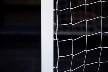 Soccer football net background over gray background and blurry stadium. Football,soccer field.