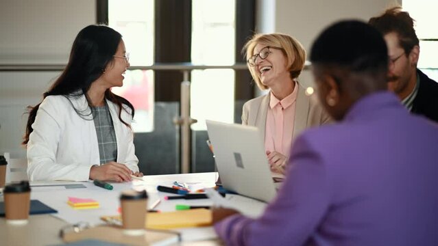 Two multiracial business woman talking about project  during a meeting