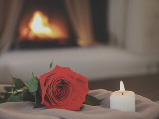 red rose and candle