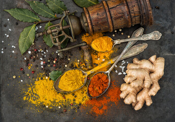 Spices curry powder, turmeric, ginger, bay leaf. Food background