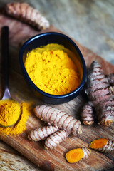 Turmeric. Turmeric root. Powder turmeric seasoning.