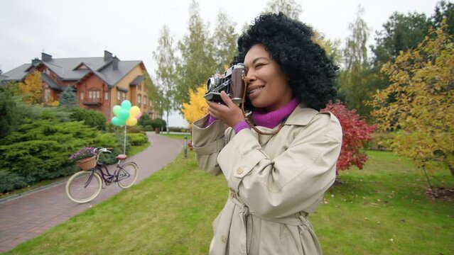 Female photographer enjoying scenic views of natural environment in city suburbs. Portrait of a woman with dark, ethnic hair enjoy picturesque, weekend stroll. High quality 4k footage