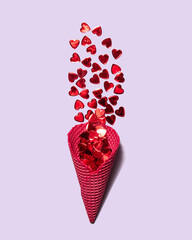 Red hearts in ice cream cone on pastel light purple background. Minimalistic love concept. Creative...