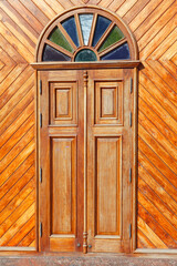 Wooden door with arch