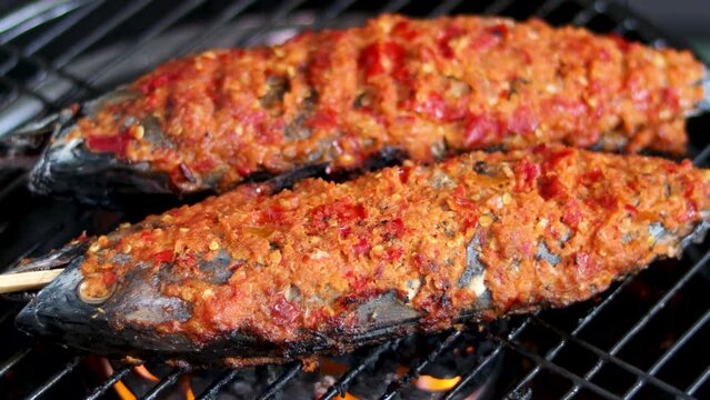 Asian food. Grilled skipjack tuna with spicy spices is a typical seafood dish from East Java, Indonesia