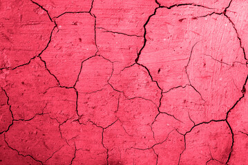 The texture of dry cracked earth. New 2023 trending PANTONE 18-1750 Viva Magenta color.