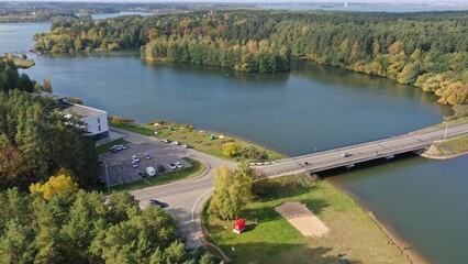 Zhdanovichi, Belarus - 01.10.2022: Bridge across the Drozdy reservoir near Minsk. Cars drive over the bridge. Bridges of Belarus. Recreational zone Zhdanovichi near Minsk.