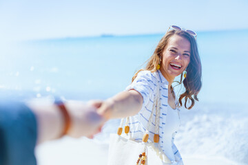 happy elegant woman at beach having fun time