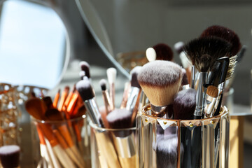 Set of professional brushes and mirror, closeup