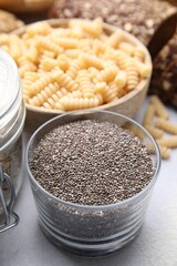 Chia seeds and different gluten free products on white table